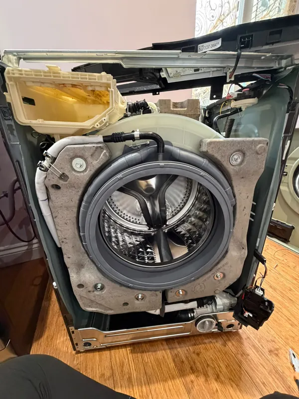 Washing machine with front panel removed — LCDA repair visit